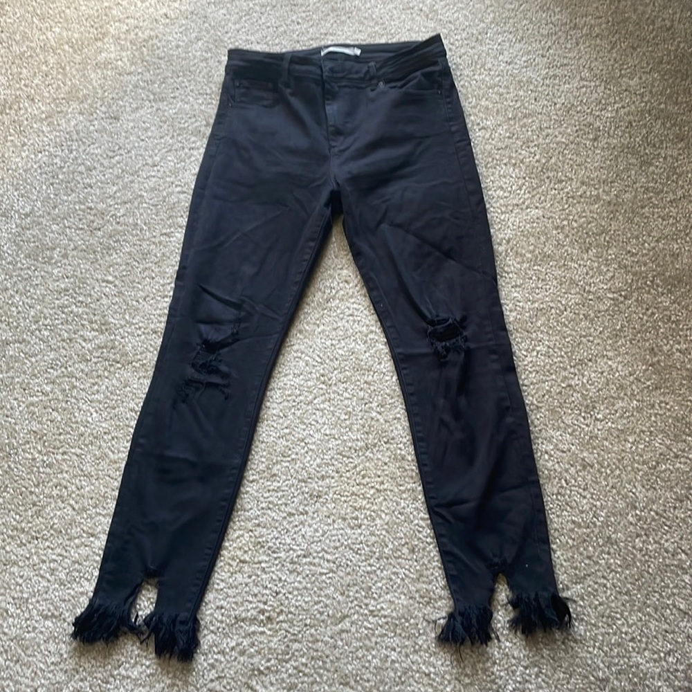 Black tractor jeans. Size 29. Flare bottom with holes in knees